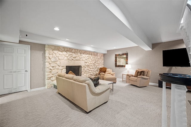 living room with a fireplace and light colored carpet