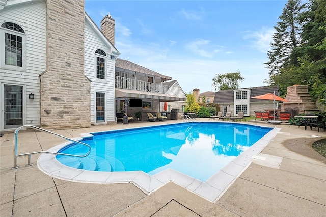 view of pool featuring a patio area