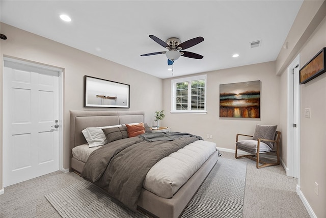 bedroom with ceiling fan and light colored carpet