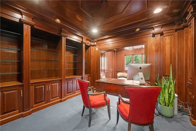 carpeted office with wood walls, crown molding, and wood ceiling