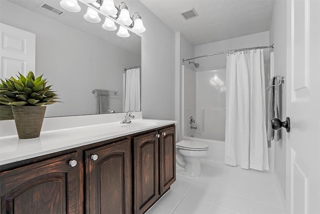 full bathroom with vanity, a textured ceiling, tile patterned flooring, toilet, and shower / bath combo with shower curtain