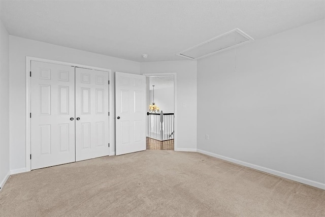 unfurnished bedroom with a closet and carpet floors