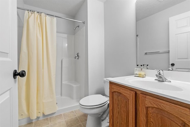 bathroom with curtained shower, vanity, a textured ceiling, and toilet