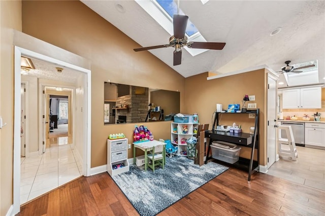 game room featuring ceiling fan, lofted ceiling, and light hardwood / wood-style floors