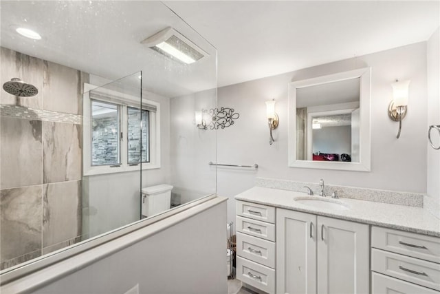 bathroom featuring vanity and a shower