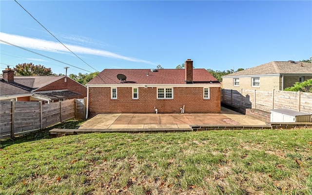 969 Kirsopp Ave, Banksville/Westwood, PA 15220 - back of property with a patio, a chimney, and brick siding