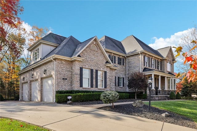 view of front of home with a garage and a front lawn