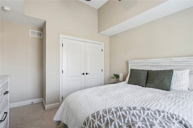 carpeted bedroom with a closet