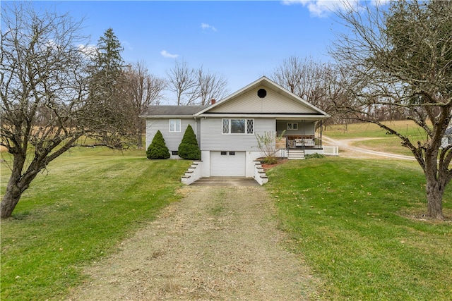 view of front of house with a front lawn and a garage