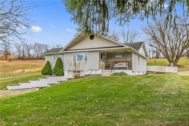 view of front facade with covered porch and a front lawn