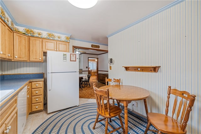 kitchen featuring light tile patterned flooring, crown molding, light brown cabinetry, white appliances, and ceiling fan