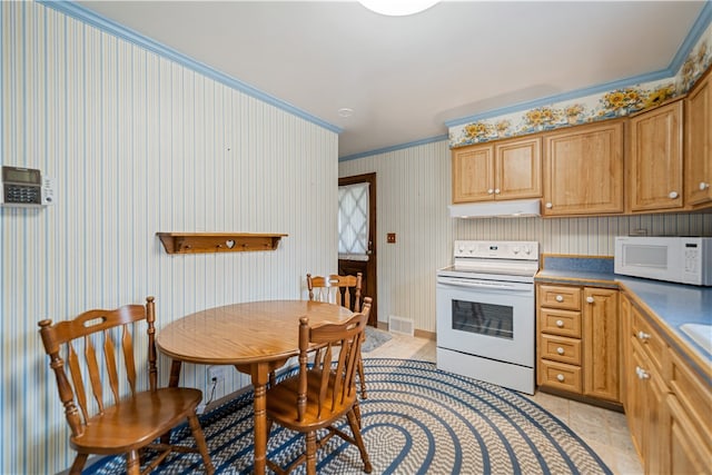 kitchen featuring white appliances, light tile patterned floors, and crown molding