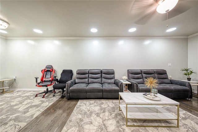 living room featuring crown molding, hardwood / wood-style flooring, and ceiling fan