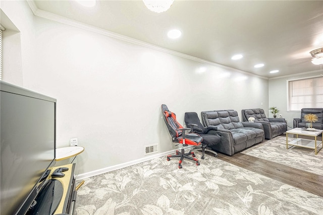 interior space with hardwood / wood-style floors and ornamental molding