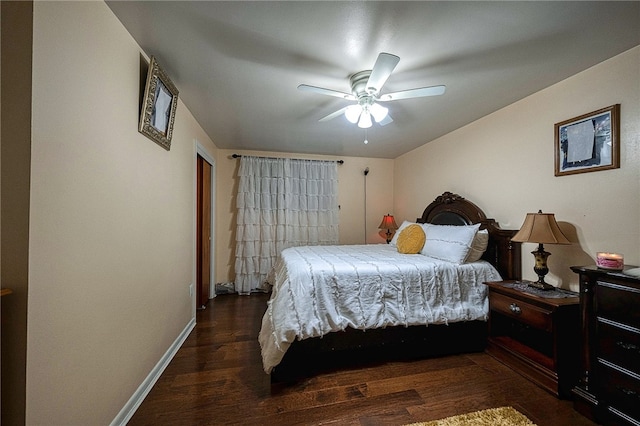 bedroom with ceiling fan and dark hardwood / wood-style flooring