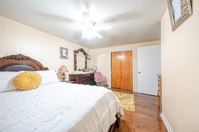 bedroom featuring hardwood / wood-style floors and ceiling fan