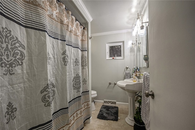 bathroom with toilet, tile patterned floors, curtained shower, and crown molding