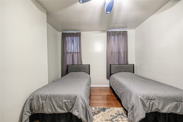 bedroom featuring ceiling fan and wood-type flooring