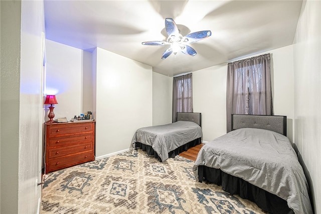 bedroom featuring hardwood / wood-style flooring and ceiling fan