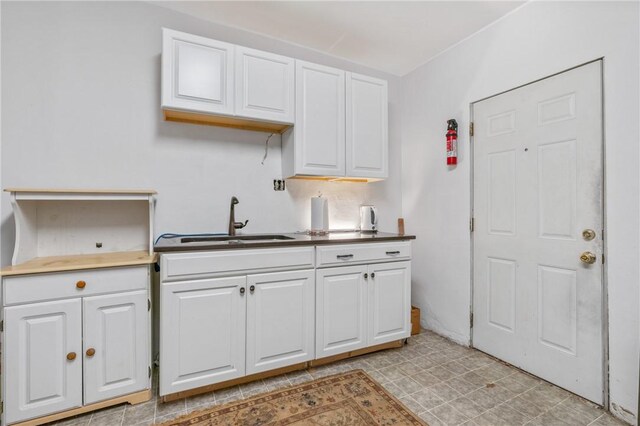 6824 Butler St, Morningside, PA 15206 - kitchen featuring a sink, white cabinetry, and light floors