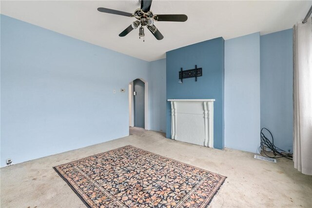 6824 Butler St, Morningside, PA 15206 - empty room with carpet flooring, arched walkways, and a ceiling fan