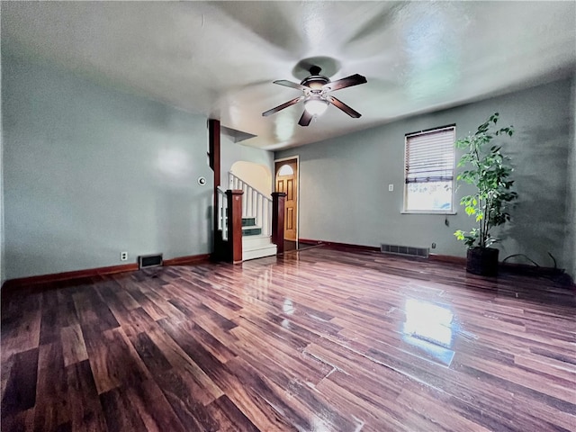 unfurnished living room with hardwood / wood-style flooring and ceiling fan