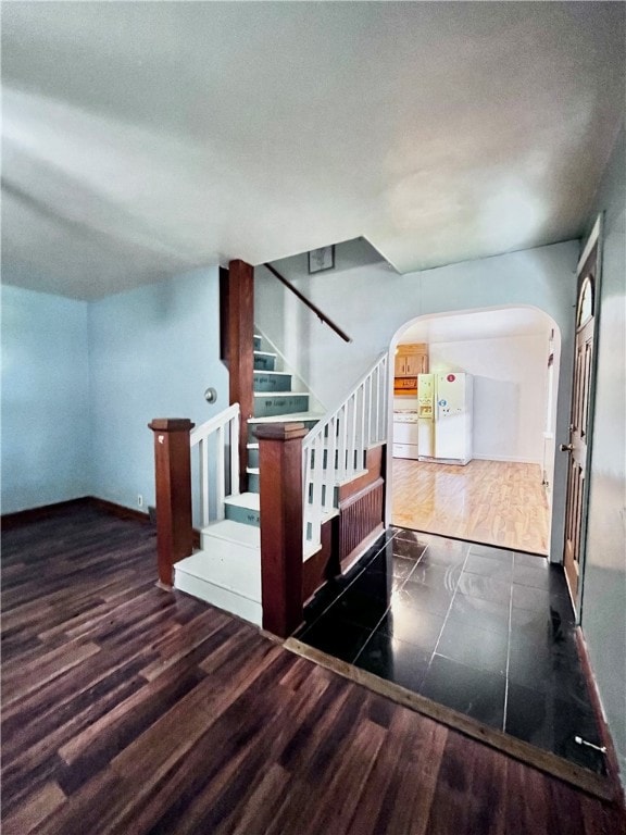 additional living space featuring dark hardwood / wood-style flooring