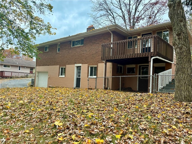 back of property featuring a garage