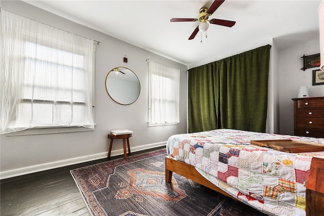 bedroom with multiple windows, ceiling fan, and dark hardwood / wood-style floors