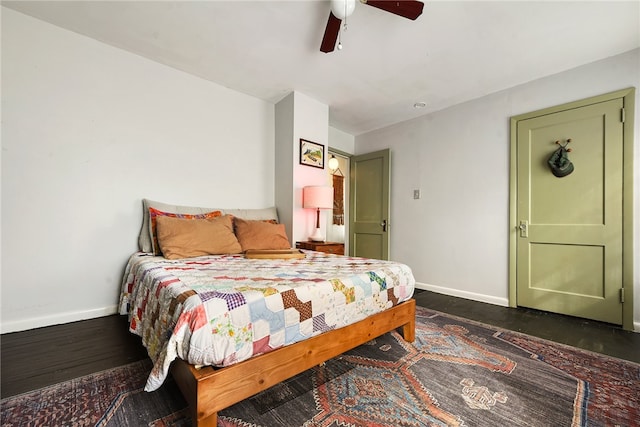 bedroom featuring dark wood-type flooring and ceiling fan