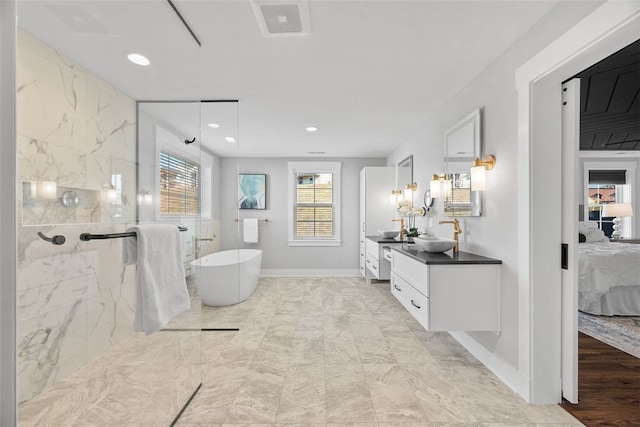 bathroom with hardwood / wood-style flooring, vanity, and plus walk in shower