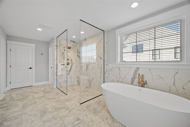 bathroom featuring separate shower and tub