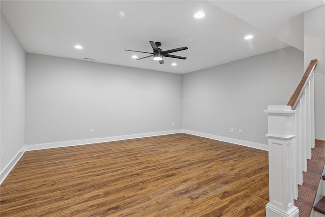 unfurnished room with dark wood-type flooring and ceiling fan