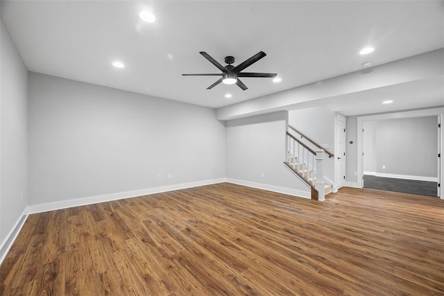 interior space with ceiling fan and dark hardwood / wood-style floors