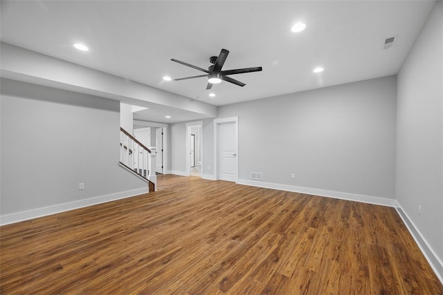 unfurnished living room featuring hardwood / wood-style flooring and ceiling fan