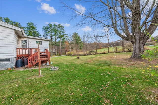 view of yard featuring a wooden deck