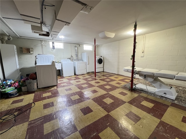 basement featuring washer and dryer and sink