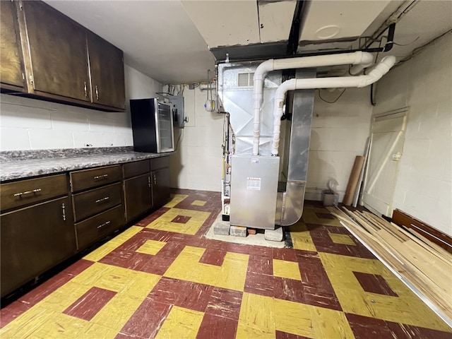 basement featuring heating unit