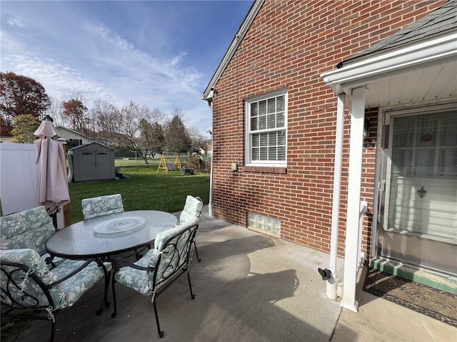 view of patio featuring a shed