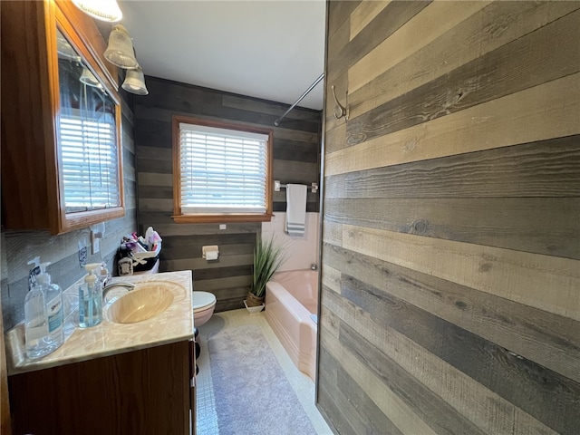 full bathroom with wood walls, tub / shower combination, and vanity