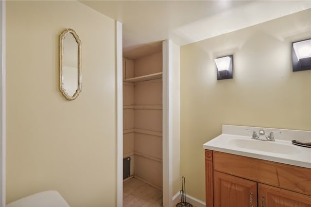 bathroom featuring vanity and hardwood / wood-style flooring