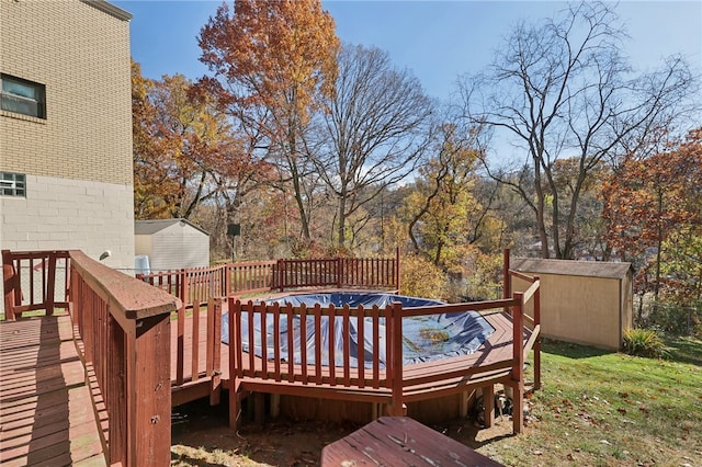 wooden deck featuring a storage unit