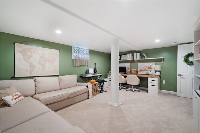 carpeted office space featuring built in desk