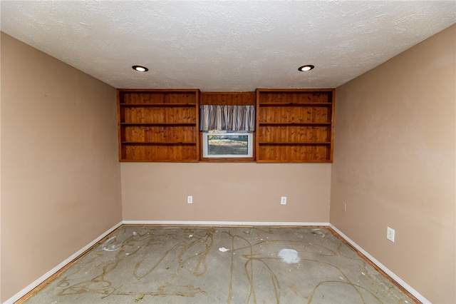 empty room featuring a textured ceiling