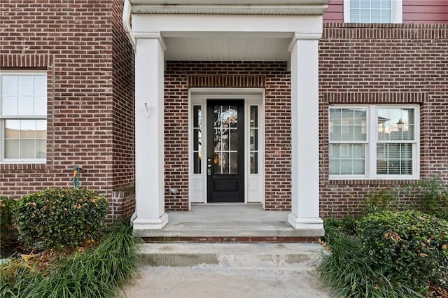 entrance to property featuring covered porch