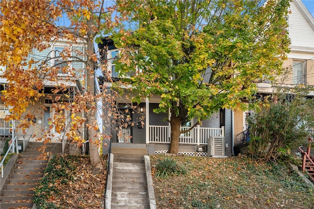 obstructed view of property with a porch