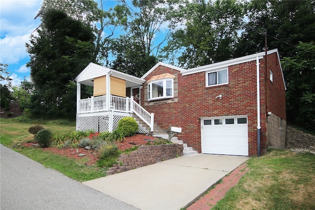 view of front of house with a garage and covered porch