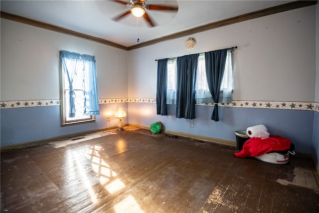 unfurnished room featuring ornamental molding, hardwood / wood-style floors, and ceiling fan