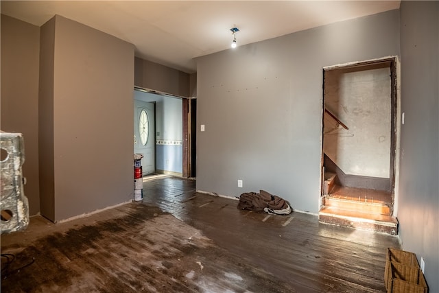 spare room featuring dark hardwood / wood-style flooring