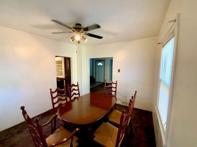 dining room featuring ceiling fan